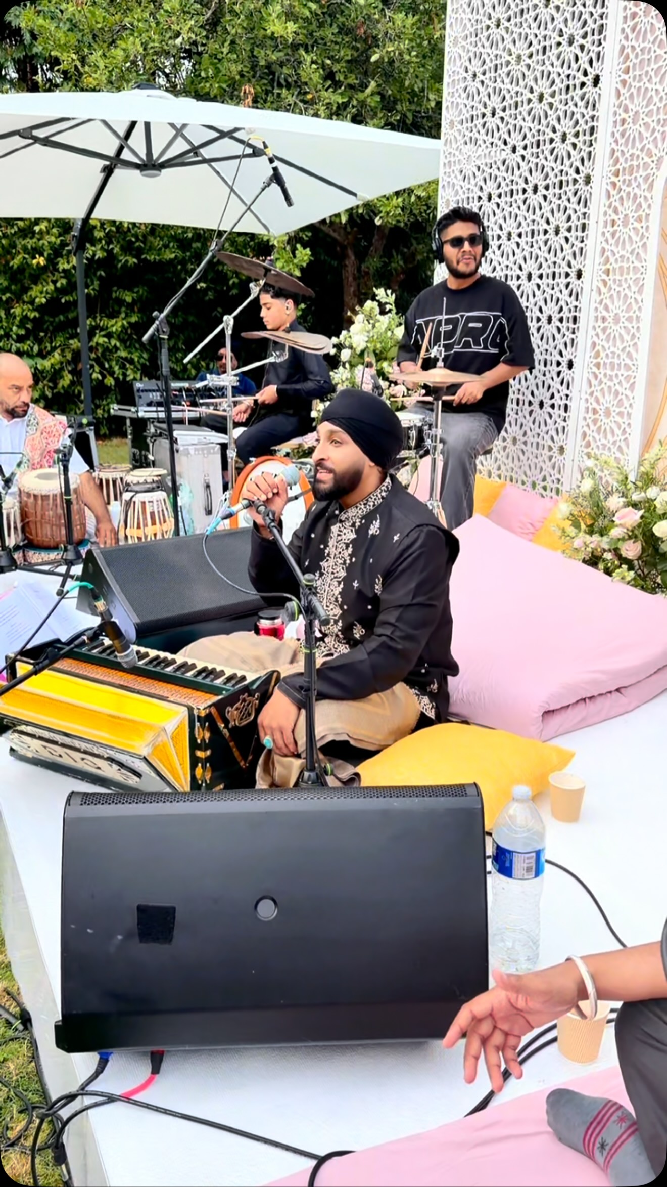 San2 performing at an outdoor celebration